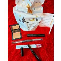 Laura geller gift set: concealer, lipstick, mascara, brushnew with a bag