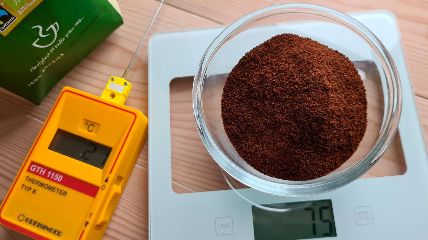 Image of coffee on the scales and the thermometer used in the testing of the coffee machines