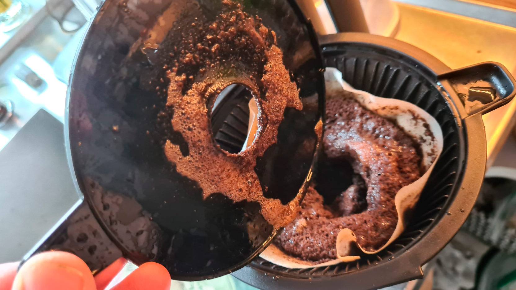 Image of coffee grounds under the lid of the filter holder