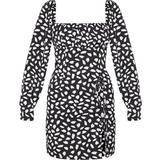 PrettyLittleThing Dalmatian Print Bow Detail Side Split Bodycon Dress - Black