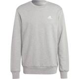 Adidas Jumpers on sale adidas Essentials Cotton Hoodie with Embroidered Logo