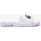 Lacoste Men Slippers & Sandals Lacoste SERVE SLIDE DUAL 09221CMA white male Sandals & Slides now available at BSTN in