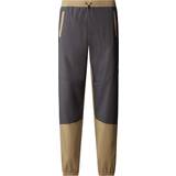 The North Face Trousers The North Face Men’s MA Wind Track Trousers Kelp Tan-Anthracite Grey